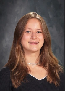 headshot of student with gray background